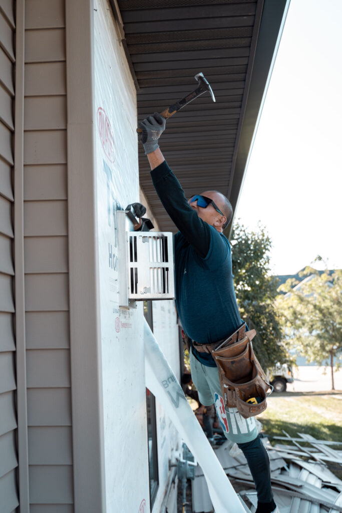 Superstorm employee installing siding - Superstorm Roofing & Siding Superstorm employee installing siding