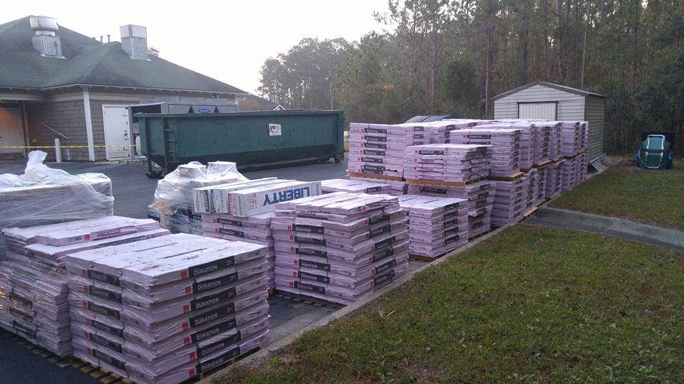 Roofing Materials Staged for Iowa Roof Replacement by Superstorm - Superstorm Roofing & Siding Roofing shingle materials staged and ready for installation by Superstorm Roofing and Siding Central Iowa